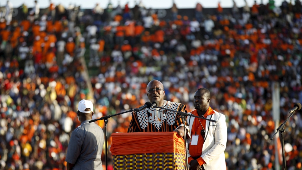 Presidential candidate Kabore speaks to supporters at his last campaign rally in Ouagadougou on November 27 [Joe Penney/Reuters]