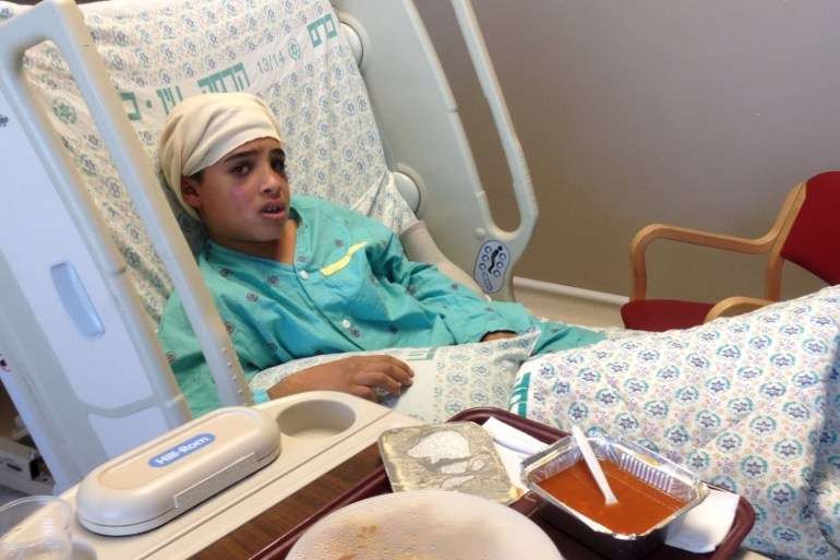 Handout showing Manasra sitting in his hospital bed in Jerusalem