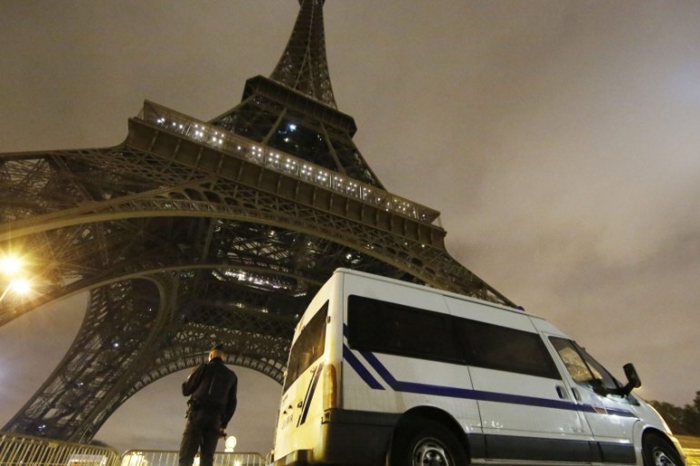 A police officers stands guard at the foot of the Eiffel Tower in Paris, France [EPA]