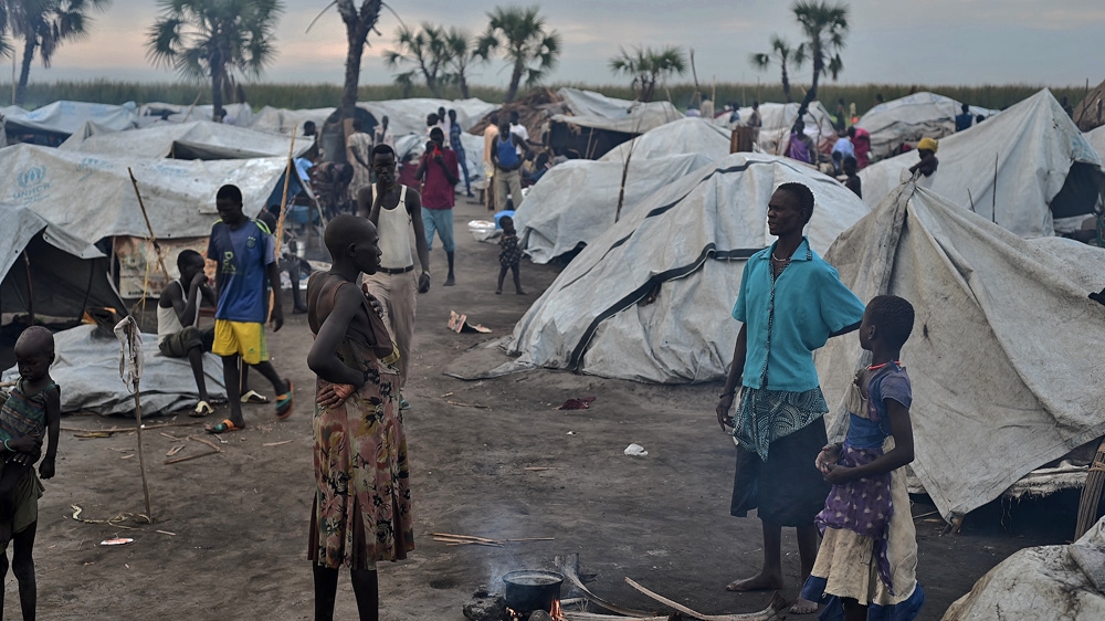 Kok island, where hundreds of displaced civilians are seeking shelter from the war under tarps and mosquito nets [Jason Patinkin/Al Jazeera] 