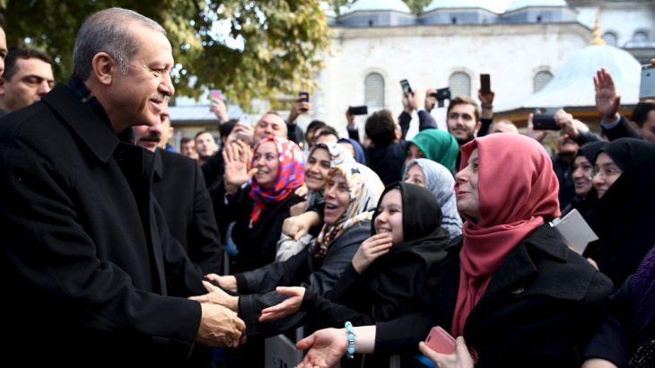 Erdogan is greeted by his supporters during his visit to the Eyup Sultan mosque in Istanbul, Turkey