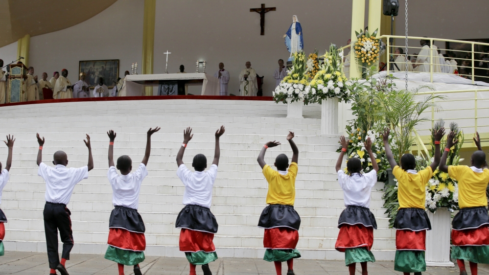 Children dance as Pope Francis celebrates a Mass at the campus of the University of Nairobi, Kenya [Andrew Medichini/AP Photo]