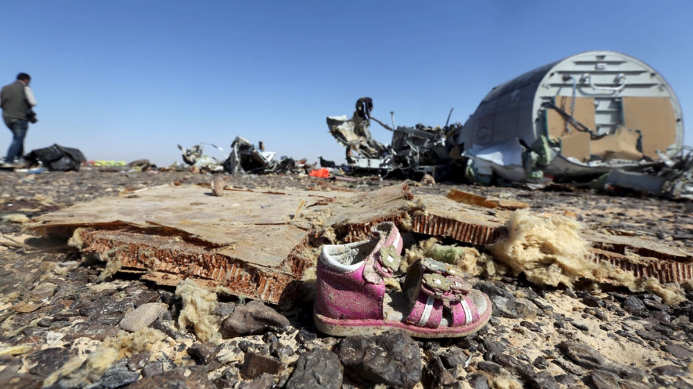 A child's shoe is seen amid debris from the Russian airliner which crashed in the Hassana area of Arish city, northern Sinai [Reuters]