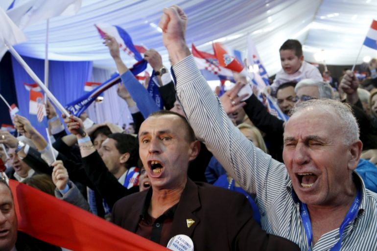 Supporters of the Croatian Democratic Union (HDZ) celebrate after exit polls in Zagreb