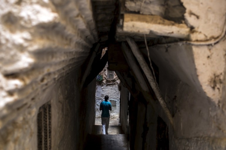 A man walks downs the alley of the old city of Algiers Al Casbah