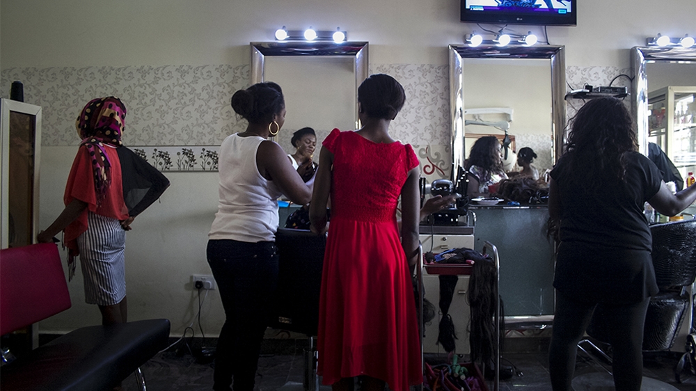 While at a salon in September in the Nigerian capital of Abuja, Mohammed is horrified to learn of a bombing in a Yola IDP camp [Caelainn Hogan/Al Jazeera]