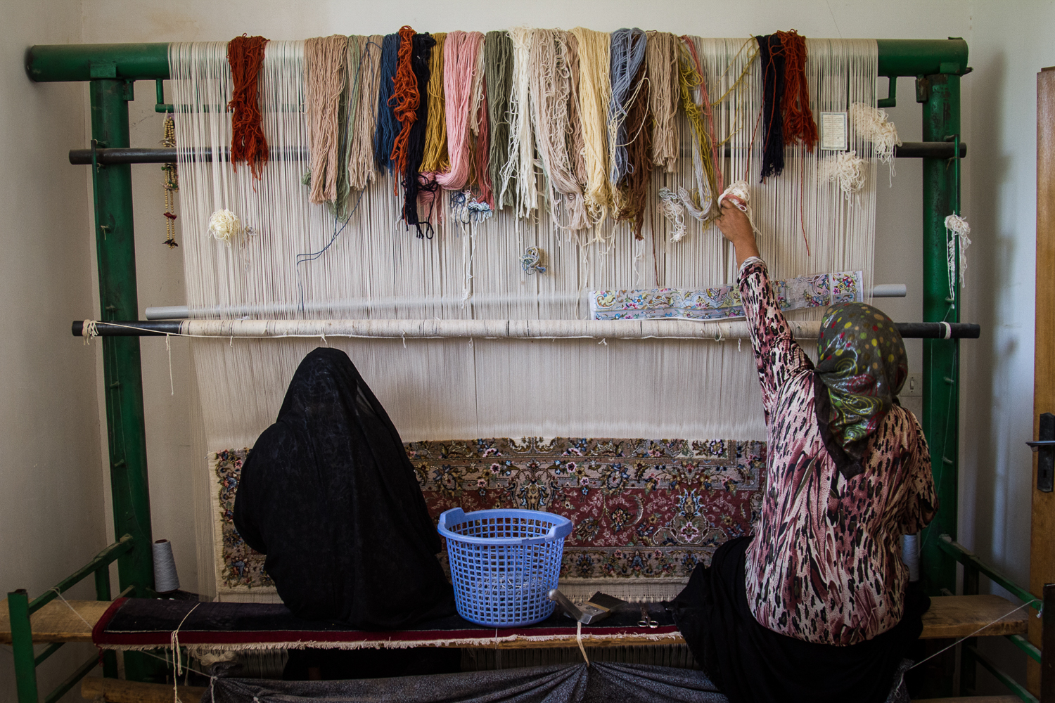 An estimated two million Iranians are employed in the country's carpet industry [Mohammad Ali Najib/Al Jazeera]