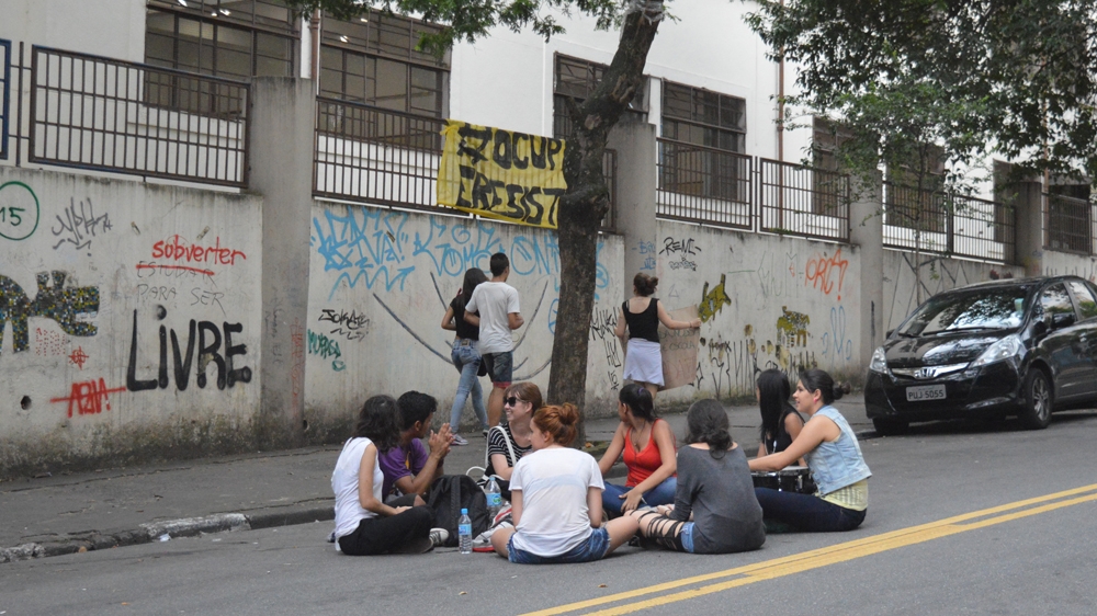 Supporters outside the Godofredo Furtado school moments after it was occupied [Gustavo Oliveira] [Al Jazeera]