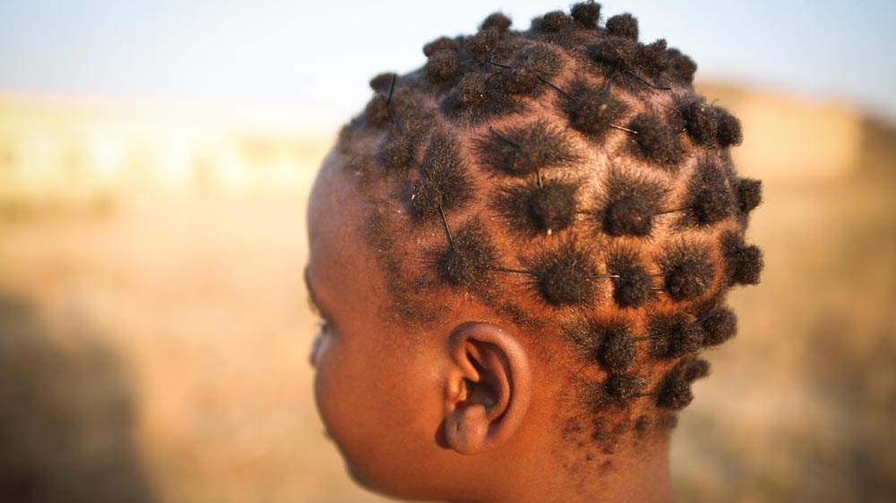 A young girl with a traditional Nigerian hairstyle [Emmanuel David/Al Jazeera]