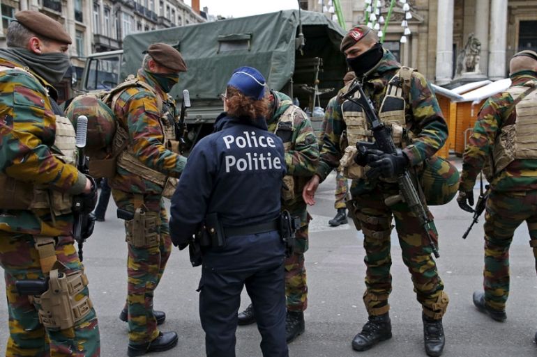 Belgian soldiers and police patrol in central Brussels as police search the area during a continued high level of security following the recent deadly Paris attacks, Belgium, November 24, 2015. REUTER