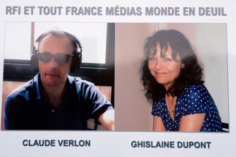 The portraits of the two journalists working for Radio France Internationale shot dead in Mali - Ghislaine Dupont and Claude Verlon [Getty]