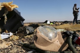 A debris from a Russian airliner is seen at its crash site at the Hassana area in Arish city