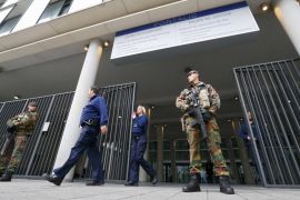 Armed soldiers stand guard outside courthouse in Brussels