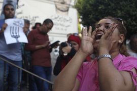 A protester chants slogans during a protest in support of imprisoned activists who are in a hunger strike at prison, in front of the Press Syndicate, in Cairo