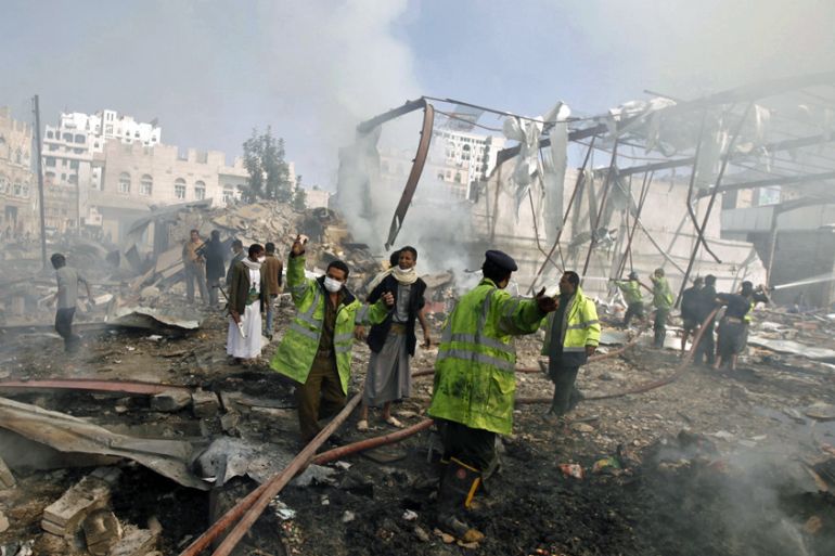 Firefighters react as they put out a fire at a food storage warehouse hit by a Saudi-led air strike in Yemen''s capital Sanaa
