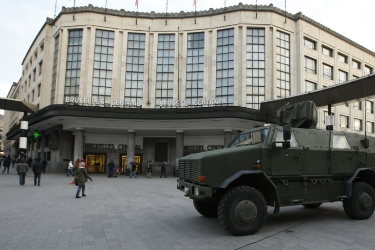 Belgian army armoured vehicle stands parked in front of the central railway station in Brussels