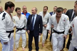 Putin speaks to athletes before his late-night meeting with the heads of Russia''s sports federations in the Black Sea resort of Sochi, Russia [AP]