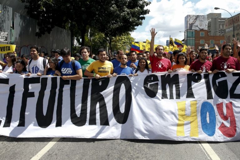 Opposition students hold a banner that reads "The future starts today" while they take part in a rally against President Nicolas Maduro''s government on University Student Day, in Caracas