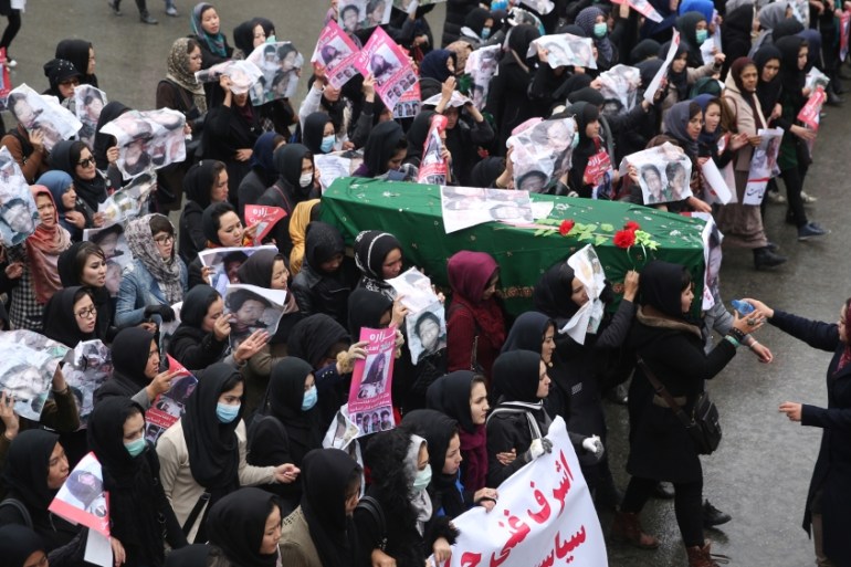Afghan women carry the coffin of a 9 year-old girl as thousands march in the Afghan capital of Kabul on Wednesday [AP]