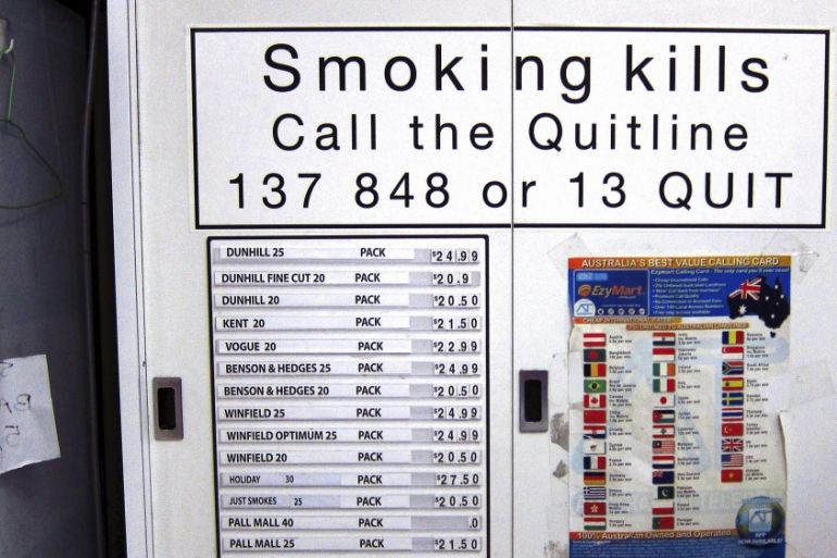 File photo of a cabinet containing cigarettes displaying their sale prices at a store located in central Sydney, Australia