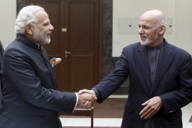 India''s PM Modi shakes hand with Afghanistan''s President Ashraf Ghani during inauguration of Afghanistanâ€™s new parliament building in Kabul