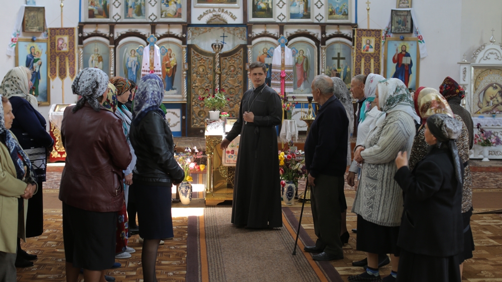  With the new priest, villagers say that they now can praise God in Ukrainian instead of the old Slavonic used by their previous priest   [Rabii Kalboussi/Al Jazeera] 