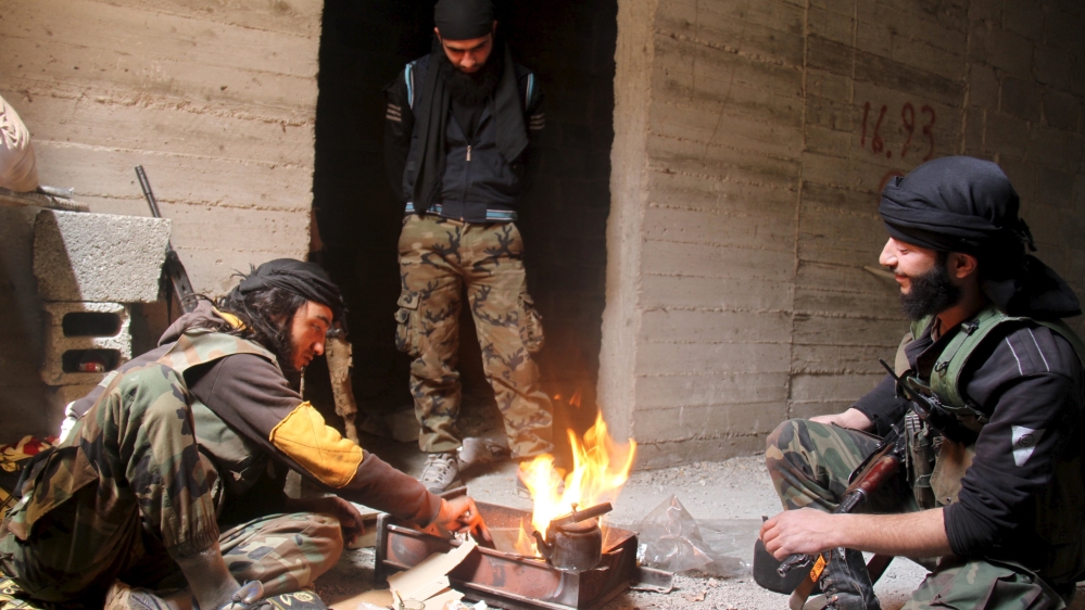 Free Syrian Army fighters prepare tea as they rest inside a building near the frontline against what they said were ISIL fighters in the Yarmouk camp REUTERS/[File: Ward Al-Keswani/Reuters]
