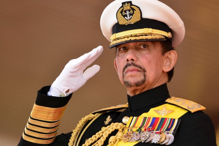 Brunei''s Sultan Hassanal Bolkiah salutes during his 69th birthday celebrations in Bandar Seri Begawan, Brunei