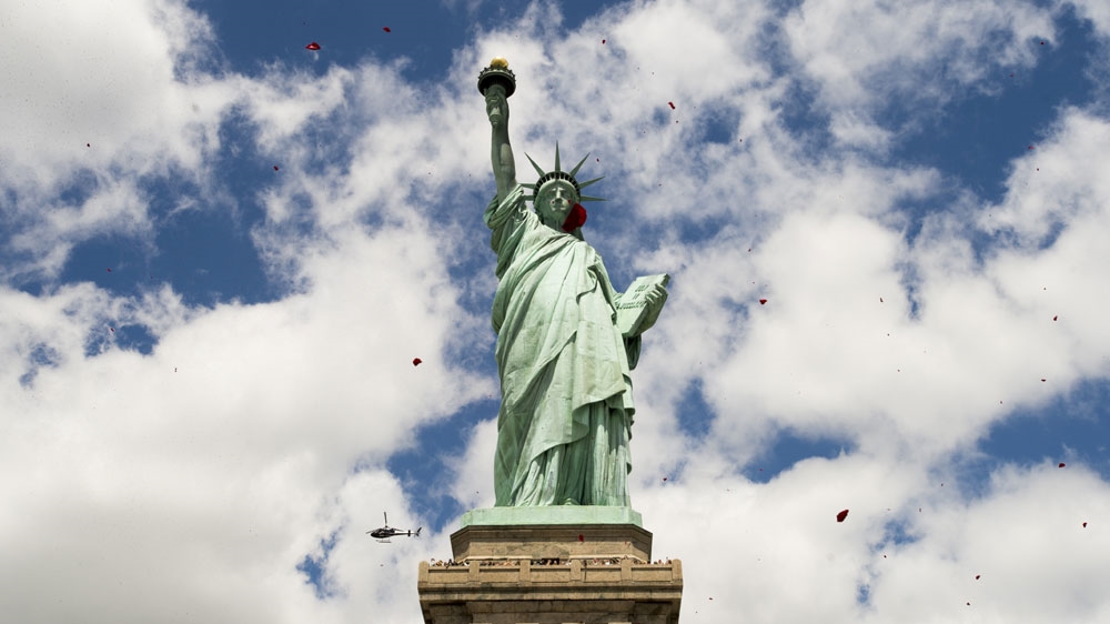 The Statue of Liberty, which has greeted immigrants to US since 1886, was inspired by a project representing an Arab woman [EPA]