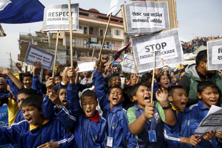 Nepalese students holding placards take part in a protest to show solidarity against the border blockade in Kathmandu