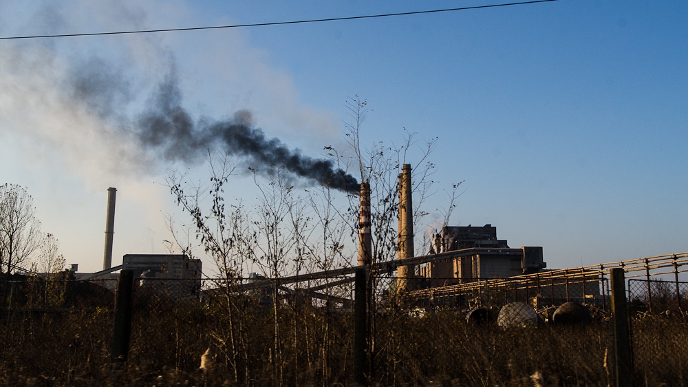 Smoke is released from one of the functioning chimneys of the Kosovo A power plant, considered to be the single most polluting source in Europe and at one point, the biggest power plant in the Balkans [Valerie Plesch/Al Jazeera]