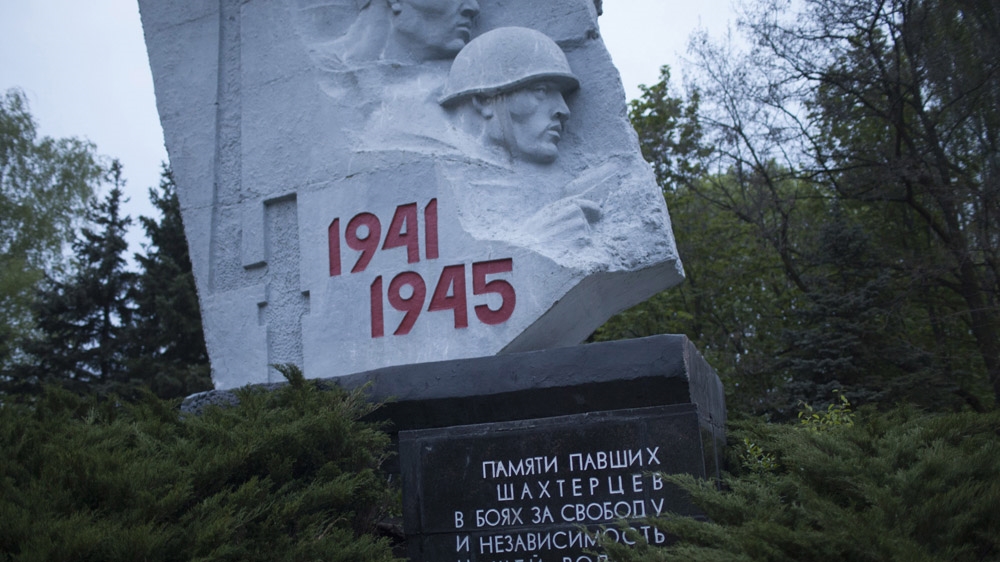 This monument in Shakhtiorsk is dedicated to the miners who died fighting in World War II, which in Russia is known as the Great Patriotic War. The victory over Nazi Germany, and the enormous sacrifices that accompanied it, are still central to the identity of the people of Donbass. [Janos Chiala and Tali Mayer/Al Jazeera]  