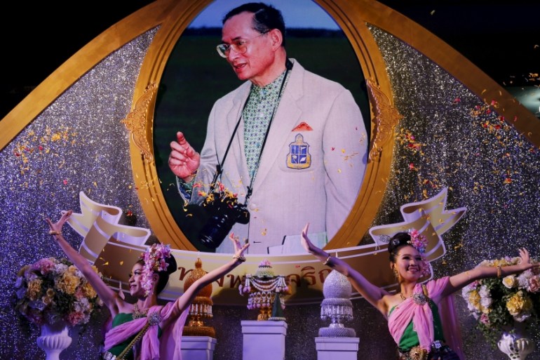 Traditional dancers perform on stage to celebrate Thailand''s King Bhumibol Adulyadej''s 88th birthday in front of Grand Palace in Bangkok