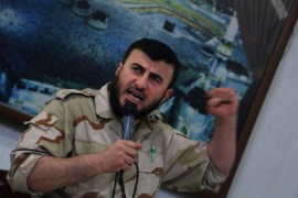 Zahran Alloush, commander of Jaysh al Islam, talks during a conference in the town of Douma, eastern Ghouta in Damascus
