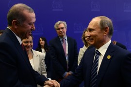 Erdogan shakes hands with Putin at the end of the G-20 Summit in Antalya, Turkey, on November 16 [AP]