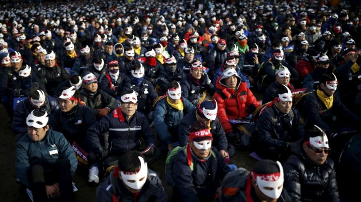 Protesters wearing masks in central Seoul