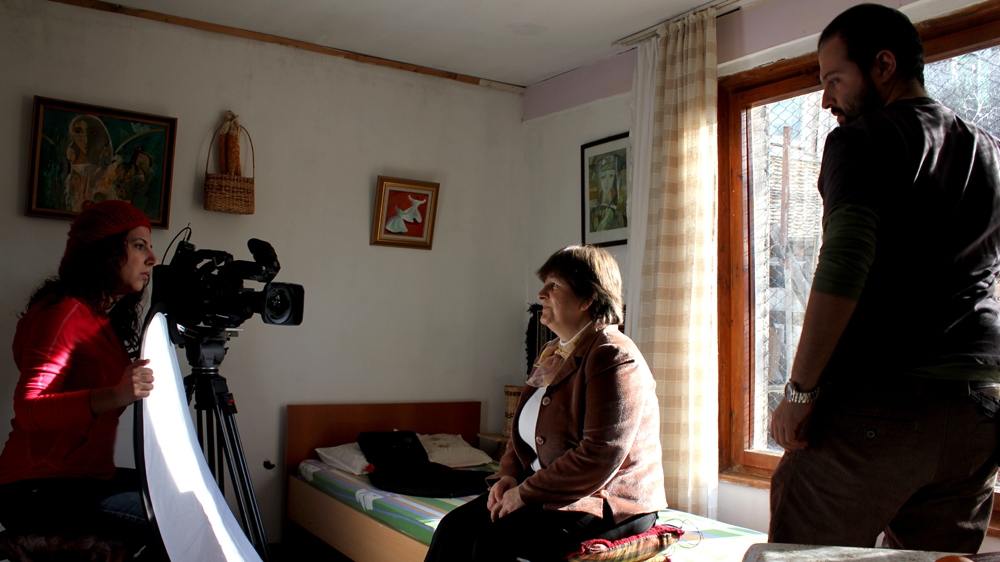 Filmmaker Yelda Yanat Bagci is photographed with cameraman Zilan Karakurt as they interview Emel Balikci Sakir in Bulgaria in 2012 [Al Jazeera]