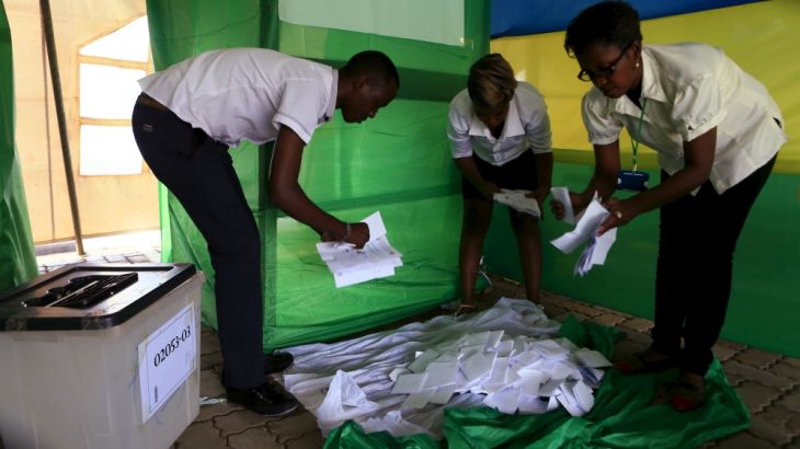 Rwanda election officials count votes as polling closes after Rwandans voted during a referendum to amend its Constitution to allow President Paul Kagame to seek a third term during next year presiden