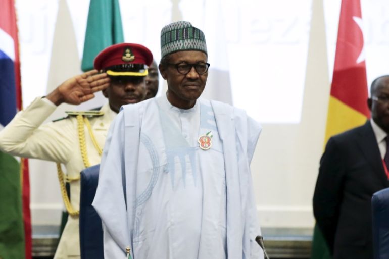 Nigeria''s President Muhammadu Buhari stands at the opening of the 48th ordinary session of ECOWAS Authority of Head of States and Government in Abuja
