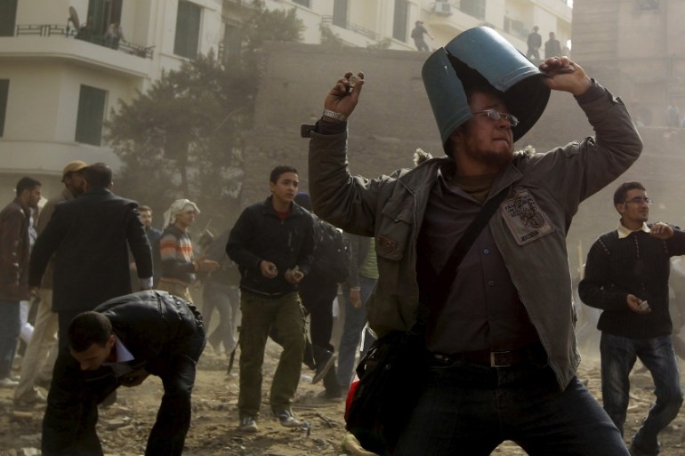 An opposition demonstrator throws a stone during rioting with pro-Mubarak supporters near Tahrir Square in Cairo (2011) [ REUTERS]
