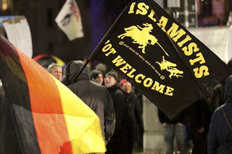 Members of LEGIDA, the Leipzig arm of the anti-Islam movement PEGIDA, take part in a rally in Leipzig