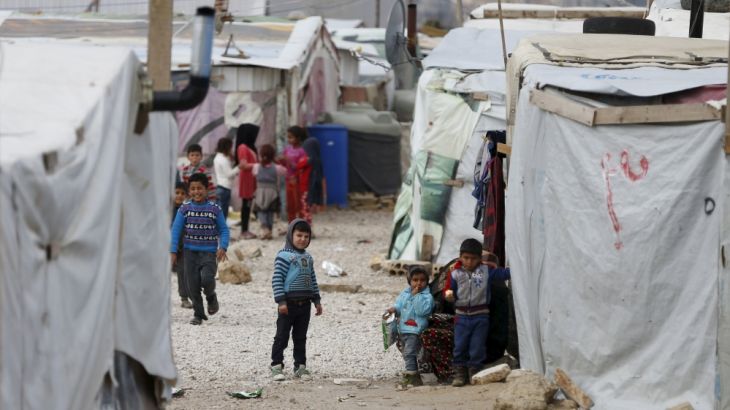 Syrian children are seen inside an informal settlement for Syrian refugees in Bar Elias, Bekaa valley, Lebanon