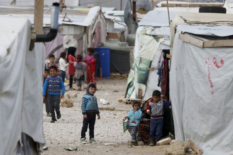 Syrian children are seen inside an informal settlement for Syrian refugees in Bar Elias, Bekaa valley, Lebanon