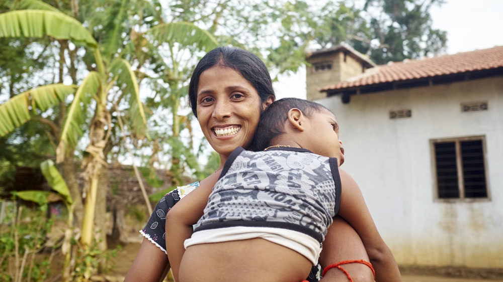 Sasi's husband was killed in the war. She lost a leg to a landmine and when she returned  after years of displacement she found her land was mined. Now it has been cleared by HALO.[Devaka Seneviratne/Halo Trust Archives/Al Jazeera]