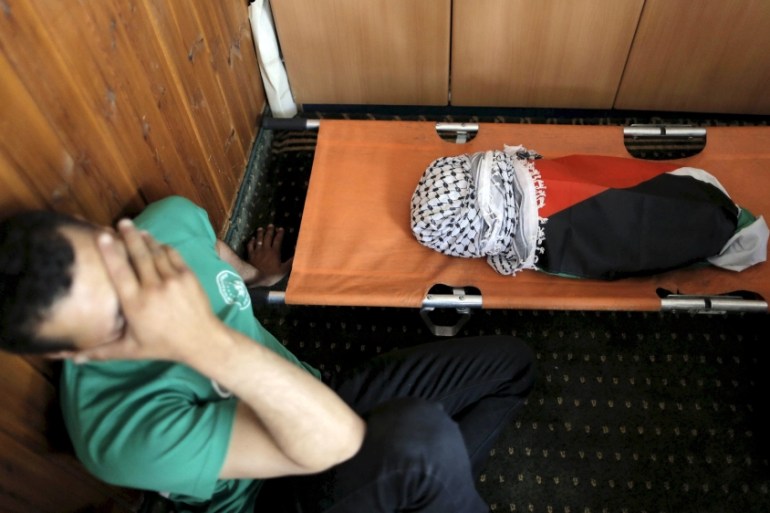 File picture shows a mourner reacting next to body of 18-month-old Palestinian baby Ali Dawabsheh, who was killed after his family''s house was set to fire in a suspected attack by Jewish extremists in