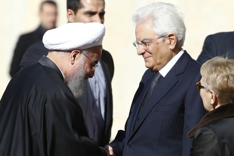 Iran President Rouhani shakes hands with Italian President Mattarella at the Quirinale presidential palace in Rome