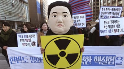 A South Korean university student participates in a rally against North Korea's announcement that it had tested a hydrogen bomb [AP]
