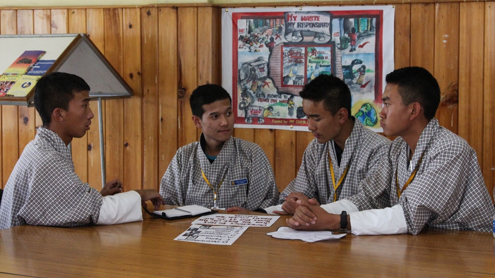 Students at Kelki school in the heart of Thimphu debate issues related to Bhutan's political transition [Neha Tara Mehta/Al Jazeera] 