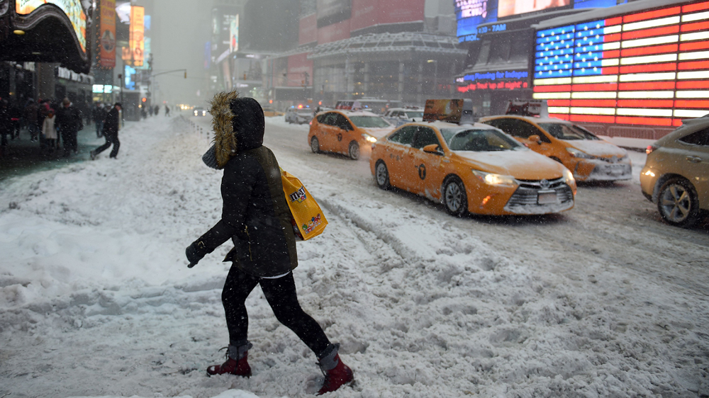 Snow covered the streets in Times Square in New York City [Astrid Riecken/Getty/AFP]