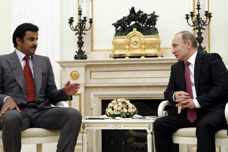 Russian President Vladimir Putin meets with Qatar Emir Sheik Tamim bin Hamad Al-Thani.